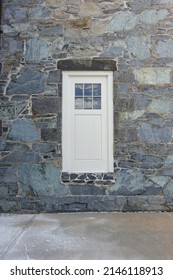 Fake Door with Window without a Stoop Embedded in a Stone WallBuilding