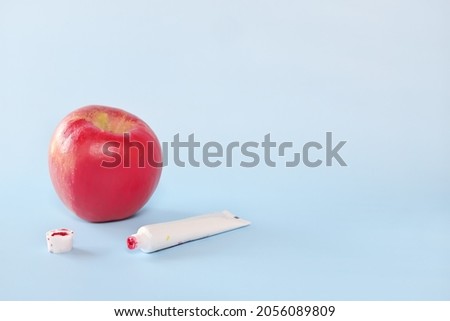 Fake food, fraud and fraudulent food concept. Apple painted red