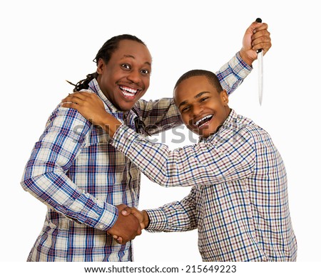 Fake friend backstabbing concept. Portrait hypocrite, crafty man gives handshake to a guy at same time trying to stab him in back with knife isolated white background. Human emotion expression feeling