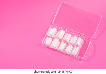 Fake Nails In Case On Pink Background