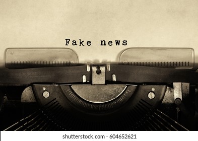 Fake news words typed on vintage typewriter.