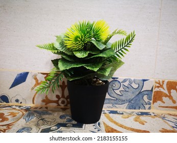 Fake Plant Vase Set On Table Decorated On White Wall Background