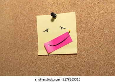 fake smile emotion face pin on sticky note on cork board concept using sticky notes be happy  - Shutterstock ID 2179265315