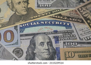 Fake Social Security Card Covered With Prop US Currency - Concept Of Social Security Benefits