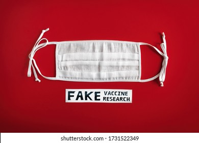 Fake Vaccine Research. The Inscription On A White Protective Mask On A Red Background. Coronavirus Lies And Virus Facts.Fake News. Deadly Type Of Virus COVID-19, Science Concept Banner. 