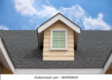 Fake Window On Garret House And Roof Shingle Wirh Blue Sky Background. Asphalt Shingles Or Bitumen Tiles.