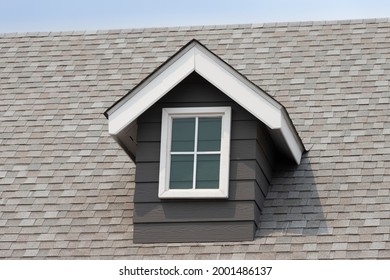 Fake Window On Garret House And Roof Shingle With Blue Sky Background. Asphalt Shingles Or Bitumen Tiles.