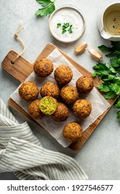falafel balls on a wooden cutting board, top view, selective focus