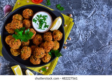 Falafel - deep fried balls of ground chickpeas with tahini sauce from