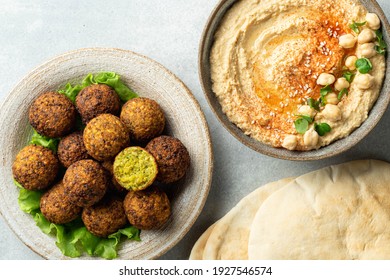 falafel, hummus, pita on a concrete background, view from above, selective focus