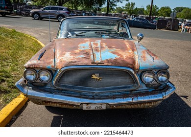 Falcon Heights, MN - June 19, 2022: High Perspective Front View Of An Old 1960 Chrysler New Yorker 2 Door Hardtop At A Local Car Show.