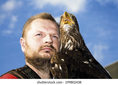 Falconer and bald eagle close up
