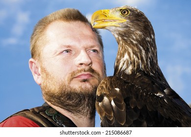 Falconer and bald eagle close up