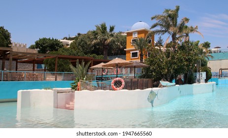 FALIRAKI, RHODES, GREECE - DECEMBER 26, 2020: WaterPark Faliraki, Wave Pool With Artificial Waves. Faliraki, Greece 