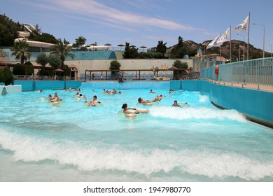 FALIRAKI, RHODES, GREECE - DECEMBER 26, 2020: WaterPark Faliraki, Wave Pool With Artificial Waves. Faliraki, Greece