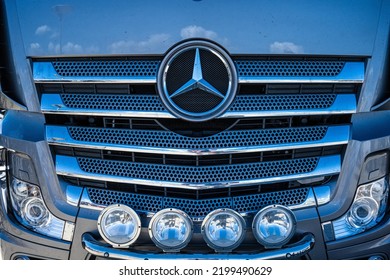 Falkenberg, Sweden - July 30 2022: Front Of A Grey Mercedes Benz Truck.