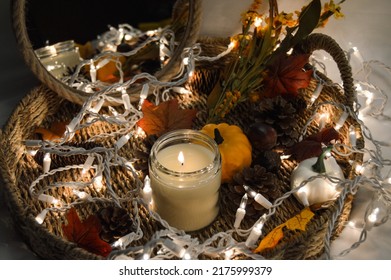 Fall Aesthetic With Candle, Lights, Fall Leaves.