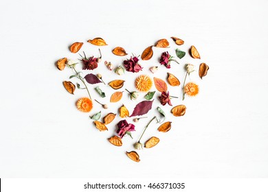 Fall. Autumn Composition. Heart Symbol Made Of Dried Flowers And Autumn Leaves. Top View, Flat Lay