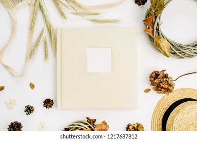 Fall Autumn Composition With Wedding Or Family Photo Album, Wreath Frame, String Bad, Rye Ears, Cones, Dry Leaves On White Background. Flat Lay, Top View Mock Up.