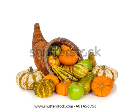 A fall or autumn cornucopia on white background.  Harvest horn of plenty.
