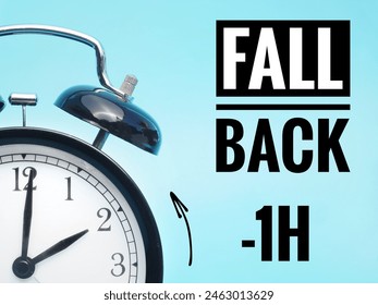  Fall back or time change concept. Alarm clock at 3 o'clock changing to Winter Time
