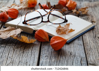 Fall Is Beginning Of The Student's Semester, Leaf And Boot On Table