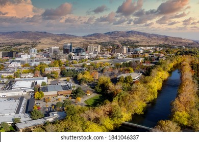 Fall in the city of trees with Boise River and downtown buildings