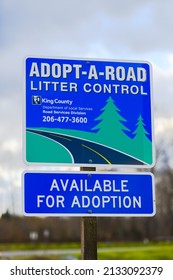 Fall City, WA, USA - March 03, 2022; Sign For Adopt A Road Litter Control In King County.  The Signage Is Available Of Adoption With A Contact Number.