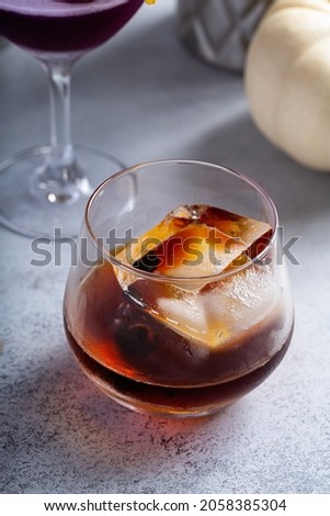Fall cocktails, old fashioned in a glass with large ice cube