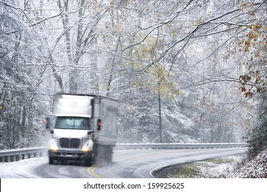 Fall color and snow, tractor trailer in hazardous highway conditions on State Route 20, Webster County, Monongahela National Forest, West Virginia, USA