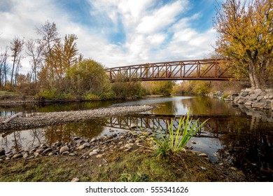 Fall Colors And Boise River With A Foot Bridge