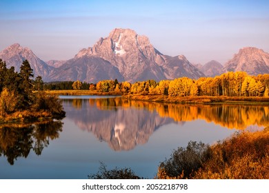 Fall colors on snake river with reflection of Mt Moran, Grand Teton, Wyoming 