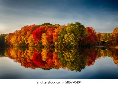 Fall Colors Reflecting in a pond - Shutterstock ID 586770404