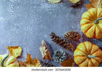 Fall Corner Border With Frosty Orange Pumpkins On A Rustic White Wood Banner Background. Overhead View With Copy Space.