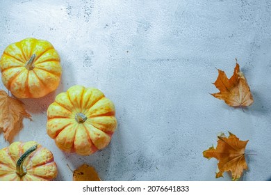 Fall Corner Border With Frosty Orange Pumpkins On A Rustic White Wood Banner Background. Overhead View With Copy Space.