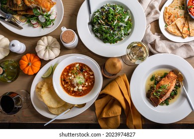 Fall Dinner Table Overhead Shot With Salad, Soup And Entrees