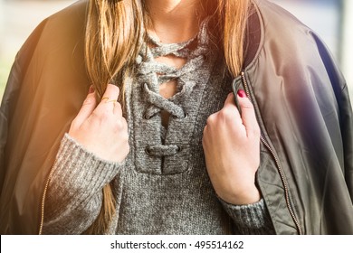 Fall Fashion Outfit Detail. Woman In An Autumn Fashion Outfit, Stylish Bomber Jacket And Grey Wool Sweater. Warm Instagram Grade

