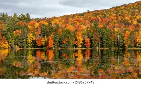 Fall Foliage along Lowell Lake in Londerry, Vermont. - Powered by Shutterstock