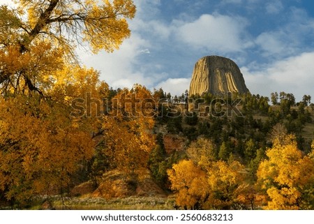 Fall Foliage frames the Devils Tower National Monument in Wyoming