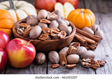 Fall Harvest Concept - Nuts, Apple, Spices And Pumpkins