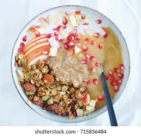 Fall Inspired Breakfast Bowl With Greek Yoghurt, Apple Sauce, Almond Butter, Granola, Apple And Pomegranate