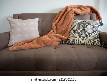 Fall Interior Design Couch With Throw Pillows With Pumpkin And Orange Throw Blanket On Love Seat