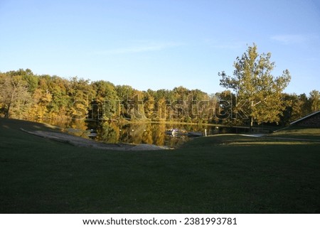 fall lake pond water ripples leaves red blue sky changing leaves colorful colors autumn 