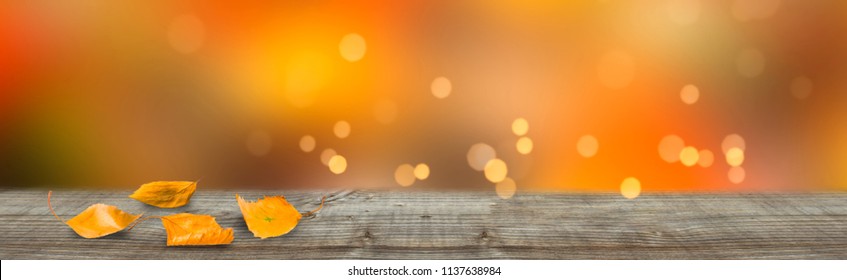 Fall Leaves On Empty Wooden Table, Empty Blurred Abstract Autumn Background With Advertising Space