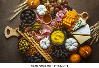 Fall Party Charcuterie Board, Top Down View On Rustic Table With Apetizer Platter