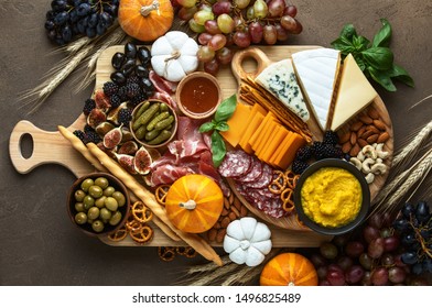 Fall Party Charcuterie Board, Top Down View On Rustic Table With Apetizer Platter