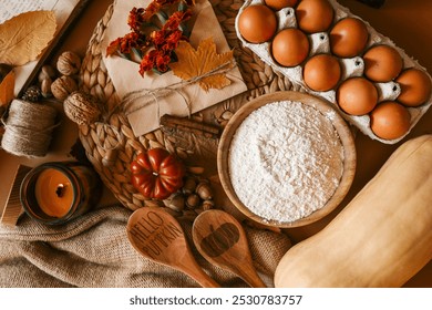 Fall pie baking ingredients with pumpkins, nuts, seasonal spices and tools. Pumpkin pie recipe idea. Thanksgiving and autumn holidays celebration concept. Top view, flat lay. - Powered by Shutterstock