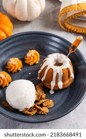 Fall Plated Dessert With A Pumpkin Spice Cake, Ice Cream And Pumpkin Mousse