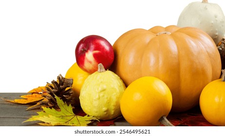 Fall produce, light orange pumpkin, yellow squash, peach, cream gourd, autumn leaves, pine cones, rustic wood surface, harvest decor, white background - Powered by Shutterstock