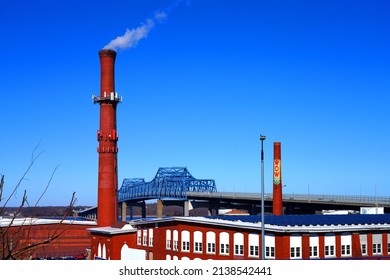 FALL RIVER, MA –5 MAR 2022- View Of An Old Brick Industrial Factory Building And Chimney Converted Into A Cell Phone Tower In  Fall River, Massachusetts, United States.